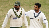 Pakistan's Inzamam-ul-Haq (left) and India's Rahul Dravid leave the ground at close of play on the last day of the first Test match in Lahore, in this January 17, 2006 file photo. AFP
