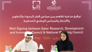 Assistant Secretary-General for the Center for Future Foresight and National Visions at the National Planning Council, Bassam Issa Al-Mannai and Executive Director of Strategies and Programmes at Qatar Research, Development and Innovation Council, Nojoud Al-Jehani during the signing ceremony.
