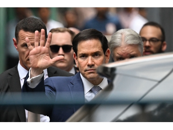 US Secretary of State Marco Rubio gestures as he walks out of the international headquarters of Missionaries of Charity known as the 