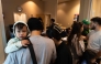 Evacuees check-in at a shelter after a chemical leak from a large storage tank threatened residents in Garden Grove, California on May 22, 2026. (Photo by Blake Fagan / AFP)