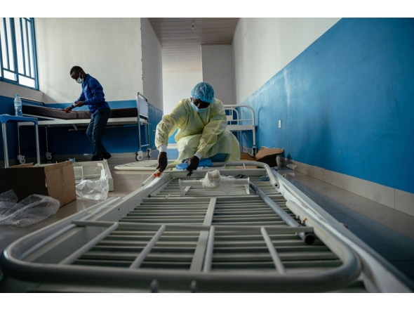 Technicians install beds and other equipment inside the isolation area for suspected cases at CBCA Virunga Hospital during rehabilitation work aimed at preparing the facility to receive potential Ebola cases, on May 22, 2026. (Photo by Jospin Mwisha / AFP)
