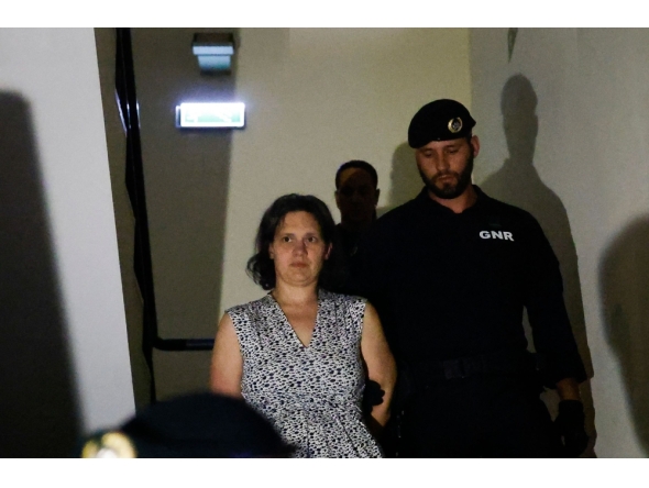 Frenchwoman Marine Rousseau (L) leaves the Setubal courthouse, suspected of abandoning two children, in Setubal, Portugal, on May 23, 2026. (Photo by Filipe Amorim / AFP)