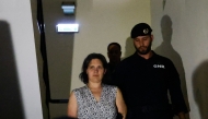Frenchwoman Marine Rousseau (L) leaves the Setubal courthouse, suspected of abandoning two children, in Setubal, Portugal, on May 23, 2026. (Photo by Filipe Amorim / AFP)