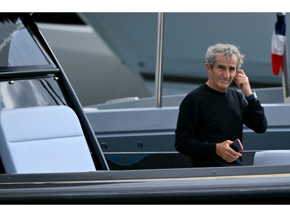 :(FILES) French former driver Alain Prost arrives by boat in the paddock of the Circuit de Monaco before the third practice session of the Formula One Monaco Grand Prix on May 25 2024, on the eve of the race. (Photo by NICOLAS TUCAT / AFP)