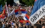 People march during an anti-government protest decrying corruption and calling for early elections following the collapse of a railway station canopy in Novi Sad that killed 16 in November 2024, in central Belgrade on May 23, 2026. (Photo by Andrej Isakovic / AFP)
 