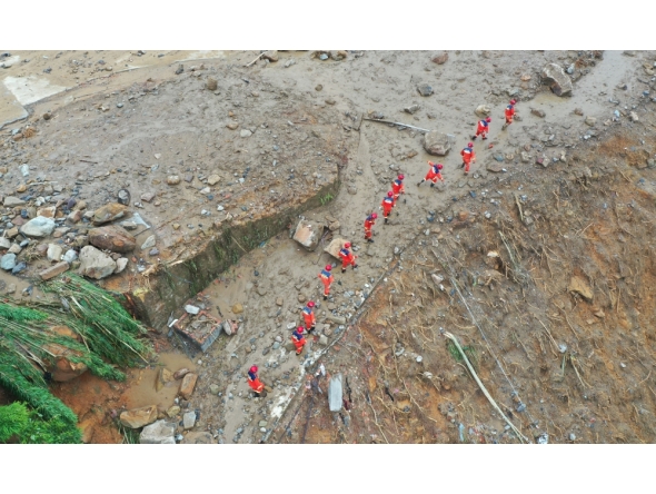 An aerial drone photo taken on May 24, 2026 shows rescuers working on site after a heavy rainstorm hit Yongchuan District in southwest China's Chongqing Municipality. (Xinhua/Wang Quanchao)