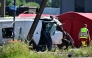 This photograph shows a damaged train car at the site of an accident after a train crashed into a school bus, at the railway crossing Vierhuizen in Buggenhout on May 26, 2026. (Photo by Dirk Waem/ BELGA / AFP)