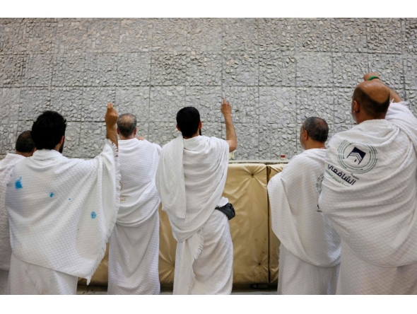Muslim pilgrims perform the symbolic 'stoning of the devil' ritual as part of the Hajj pilgrimage in Mina on May 27, 2026. (Photo by Zain Jaafar / AFP)