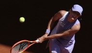 Poland's Iga Swiatek plays a backhand return to Czech Republic's Sara Bejlek during their women's singles match on day 4 of the French Open tennis tournament on Court Philippe-Chatrier at the Roland-Garros Complex in Paris on May 27, 2026. (Photo by Thomas SAMSON / AFP)