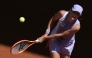 Poland's Iga Swiatek plays a backhand return to Czech Republic's Sara Bejlek during their women's singles match on day 4 of the French Open tennis tournament on Court Philippe-Chatrier at the Roland-Garros Complex in Paris on May 27, 2026. (Photo by Thomas SAMSON / AFP)
