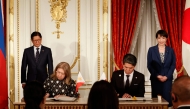 Philippines' President Ferdinand Marcos Jr (L) and Japanese Prime Minister Sanae Takaichi (R) look on as Ambassador of the Philippines to Japan Mylene J. Garcia-Albano (2nd L) and Ambassador of Japan to the Philippines Kazuya Endo (2nd R) sign documents during the Cooperation Document Exchange Ceremony at the Akasaka Palace State Guest House in Tokyo on May 28, 2026. Photo by Rodrigo Reyes Marin / POOL / AFP
