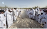 People take part in the burial of Abdullah bin Hamad Al Attiyah.