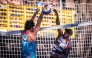 Qatar's Ahmed Tijan (right) shoots to score a point.