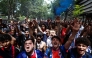 
PSG supporters chant slogans ahead of the UEFA Champions League Final football match between Paris Saint-Germain (PSG) and Arsenal FC played in Budapest, next to the Parc des Princes stadium, in Paris on May 30, 2026. (Photo by Kenzo Tribouillard / AFP)