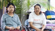 Mountaineer Dawa Sherpa's wife Damu Sherpa (R) and daughter Mendo Lhamu Sherpa (L) wait outside the intensive care unit (ICU) at HAMS Hospital in Kathmandu on June 5, 2026. (Photo by Prabin Ranabhat / AFP)