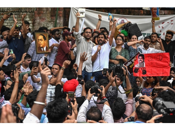Cockroach Janta Party (CJP) founder Abhijeet Dipke (C, right) shouts slogans during a protest over alleged irregularities in the country's major examinations, in New Delhi on June 6, 2026. (Photo by Arun Sankar / AFP)
 