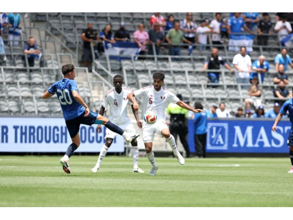 Qatar's Jassim Jaber (right) controls the ball during the match.