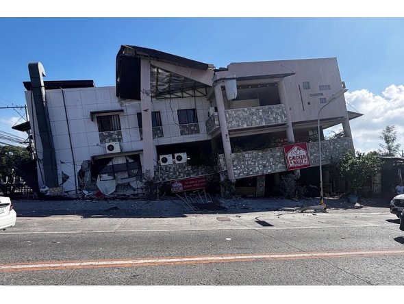 A collapsed building is seen after an 7.8 magnitude earthquake in General Santos City on June 8, 2026. (Photo by Edwin Espejo / AFP)