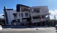 A collapsed building is seen after an 7.8 magnitude earthquake in General Santos City on June 8, 2026. (Photo by Edwin Espejo / AFP)