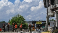 Responders conduct search and rescue operations at the site of a collapsed building after a 7.8 magnitude earthquake in General Santos City on June 9, 2026. (Photo by Jam STA ROSA / AFP)