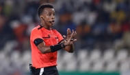 Somalian referee Omar Abdulkadir Artan gestures during the Africa Cup of Nations (CAN) 2024 group D football match between Mauritania and Algeria at Stade de la Paix in Bouake on January 23, 2024. (Photo by KENZO TRIBOUILLARD / AFP)