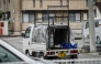 A truck with an animal cage is pictured during the search for a wild bear in Utsunomiya, north of Tokyo, on June 9, 2026. Photo by Yuichi YAMAZAKI / AFP