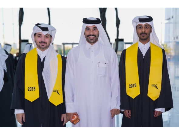 Graduating students and an official during the ceremony.