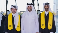 Graduating students and an official during the ceremony.
