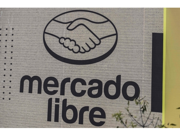 Mercado Libre is displayed on an advertising wall in Mexico City on October 1, 2025. (Photo by Yuri CORTEZ / AFP)