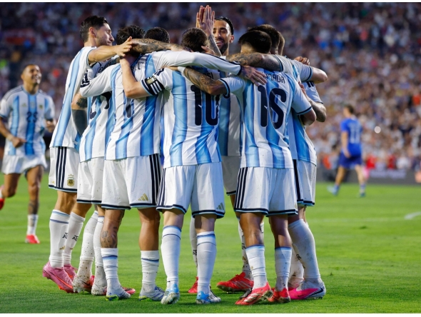 Thiago Almada of Argentina celebrates with teammates after scoring the team's third goal during the international friendly match between Argentina and Iceland at Jordan-Hare Stadium on June 09, 2026 in Auburn, Alabama.  (Photo by Todd Kirkland / AFP)
