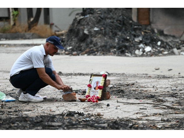 A tribute is set up for Air India Flight 171 plane crash victim Vijay Rupani, former Gujarat chief minister, at the crash site on the first anniversary of the disaster in Ahmedabad on June 12, 2026. Photo by Shammi MEHRA / AFP
