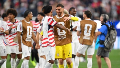 US goalkeeper #01 Matt Turner (R) and midfielder #08 Weston McKennie celebrate on June 12, 2026. (Photo by Patrick T. Fallon / AFP)
 