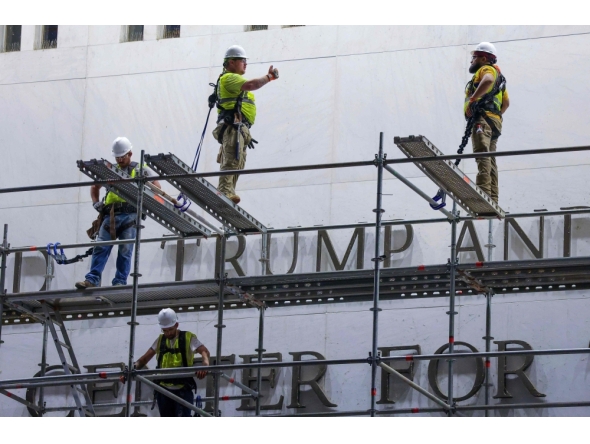 Construction crews build scaffolding outside The Kennedy Center on June 13, 2026 in Washington, DC. Friday marks the court-ordered deadline to remove President Donald trump's name from the Kennedy Center. (Photo by TASOS KATOPODIS / GETTY IMAGES NORTH AMERICA / Getty Images via AFP)