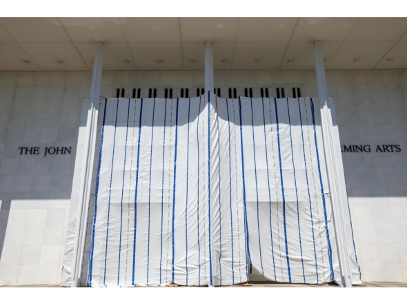 Tarps are hung on scaffolding outside The Kennedy Center on June 13, 2026 in Washington, DC. Friday late night workers removed the President Donald Trump's name from the Kennedy Center. (Photo by Tasos Katopodis/AFP)