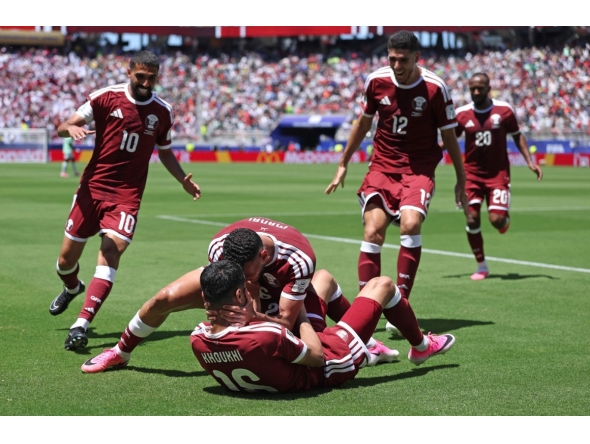 Boualem Khoukhi celebrates with teammates after scoring Qatar's first goal against Switzerland during the FIFA World Cup 2026 Group B match at San Francisco Bay Area Stadium on June 13, 2026 in Santa Clara, California.