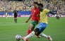 Morocco's defender #02 Achraf Hakimi adn Brazil's forward #07 Vinicius Junior fight for the ball during the 2026 World Cup Group C football match between Brazil and Morocco at the New York/New Jersey Stadium in East Rutherford on June 13, 2026. (Photo by Mauro PIMENTEL / AFP)