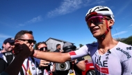 UAE Team Emirates XRG's Mexican rider Isaac Del Toro Romero celebrates winning the 8th and final stage of the Tour Auvergne-Rhone-Alpes cycling race, 120,1km between Beaufort and Plateau de Solaison, in the French Alps on June 14, 2026. (Photo by Anne-Christine POUJOULAT / AFP)