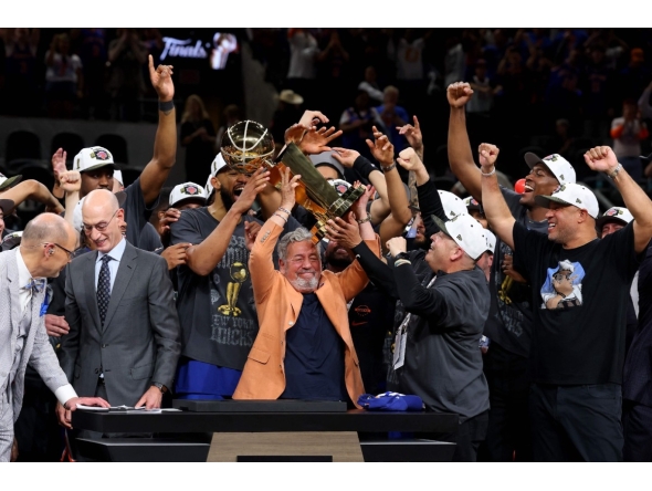 New York Knicks owner James Dolan lifts the Larry O'Brien Championship Trophy after his team defeated the San Antonio Spurs in Game Five of the 2026 NBA Finals at Frost Bank Center on June 13, 2026 in San Antonio, Texas. Gregory Shamus/Getty Images/AFP (Photo by Gregory Shamus / GETTY IMAGES NORTH AMERICA / Getty Images via AFP)
