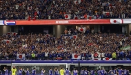 Japan's players reat with supporters after a draw in the 2026 World Cup Group F football match between the Netherlands and Japan at the Dallas Stadium in Arlington on June 14, 2026. (Photo by Aric Becker / AFP)
