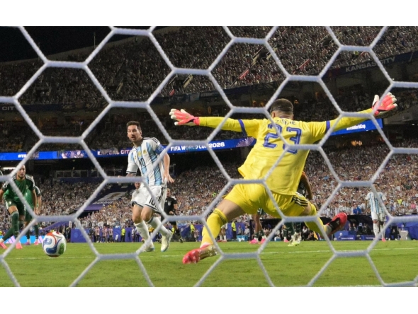 Argentina's forward #10 Lionel Messi shoots and scores his team's second goal during the 2026 World Cup Group J football match in Kansas City on June 16, 2026. (Photo by Juan Mabromata / AFP)
