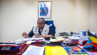 (Files) Professor Jean-Jacques Muyembe, director general of the National Institute for Biomedical Research (INRB), is seen at his office in Kinshasa, Democratic Republic of the Congo, on May 20, 2026. (Photo by Hardy Bope / AFP)