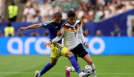 Armando Obispo #18 of Curacao challenges Kai Havertz #7 of Germany during the FIFA World Cup 2026 Group E match between Germany and Curacao at Houston Stadium on June 14, 2026 in Houston, Texas. Lars Baron/Getty Images/AFP 