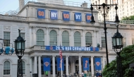 New York Knicks banners adorn the facade of City Hall ahead of the ticker tape victory parade on June 17, 2026 in New York City. Photo by Michael M. Santiago / GETTY IMAGES NORTH AMERICA / Getty Images via AFP
