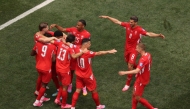 Johan Manzambi #9 of Switzerland celebrates with teammates after scoring the team's third goal during the FIFA World Cup 2026 Group B match between Switzerland and Bosnia and Herzegovina at Los Angeles Stadium on June 18, 2026 in Inglewood, California.