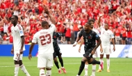 Cyle Larin #9 of Canada celebrates scoring his team's first goal during the FIFA World Cup 2026 Group B match between Canada and Qatar at BC Place Vancouver on June 18, 2026 in Vancouver, British Columbia. (Photo by Fran Santiago / GETTY IMAGES NORTH AMERICA / Getty Images via AFP)
