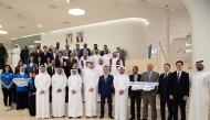 Chairman of the Board of Directors of Qatar Fund for Development H E Sheikh Thani bin Hamad Al Thani, and other officials and participants during the event.