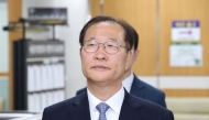 Former South Korean Justice Minister Park Sung-jae arrives for his trial at the Seoul Central District Court in Seoul on June 22, 2026. (Photo by YONHAP / AFP)