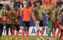 From L: Netherlands' midfielder #26 Quinten Timber, defender #04 Virgil van Dijk and forward #09 Wout Weghorst celebrate after winning the 2026 World Cup Group F football match between Tunisia and the Netherlands. (Photo by Juan Mabromata / AFP)