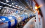 (Files) The 1232 dipole magnets that bend the path of accelerated protons are pictured in the Large Hadron Collider (LHC) in a tunnel of the European Organisation for Nuclear Research (CERN), during maintenance works on February 6, 2020 in Echenevex, France, near Geneva. (Photo by Vlentin Flauraud / AFP)
