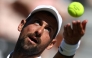 Serbia's Novak Djokovic throws the ball to serve against US player Tommy Paul during their men's singles match on day four of the Giorgio Armani Tennis Classic tournament at the Hurlingham Club in London on June 26, 2026. (Photo by Henry Nicholls / AFP)
